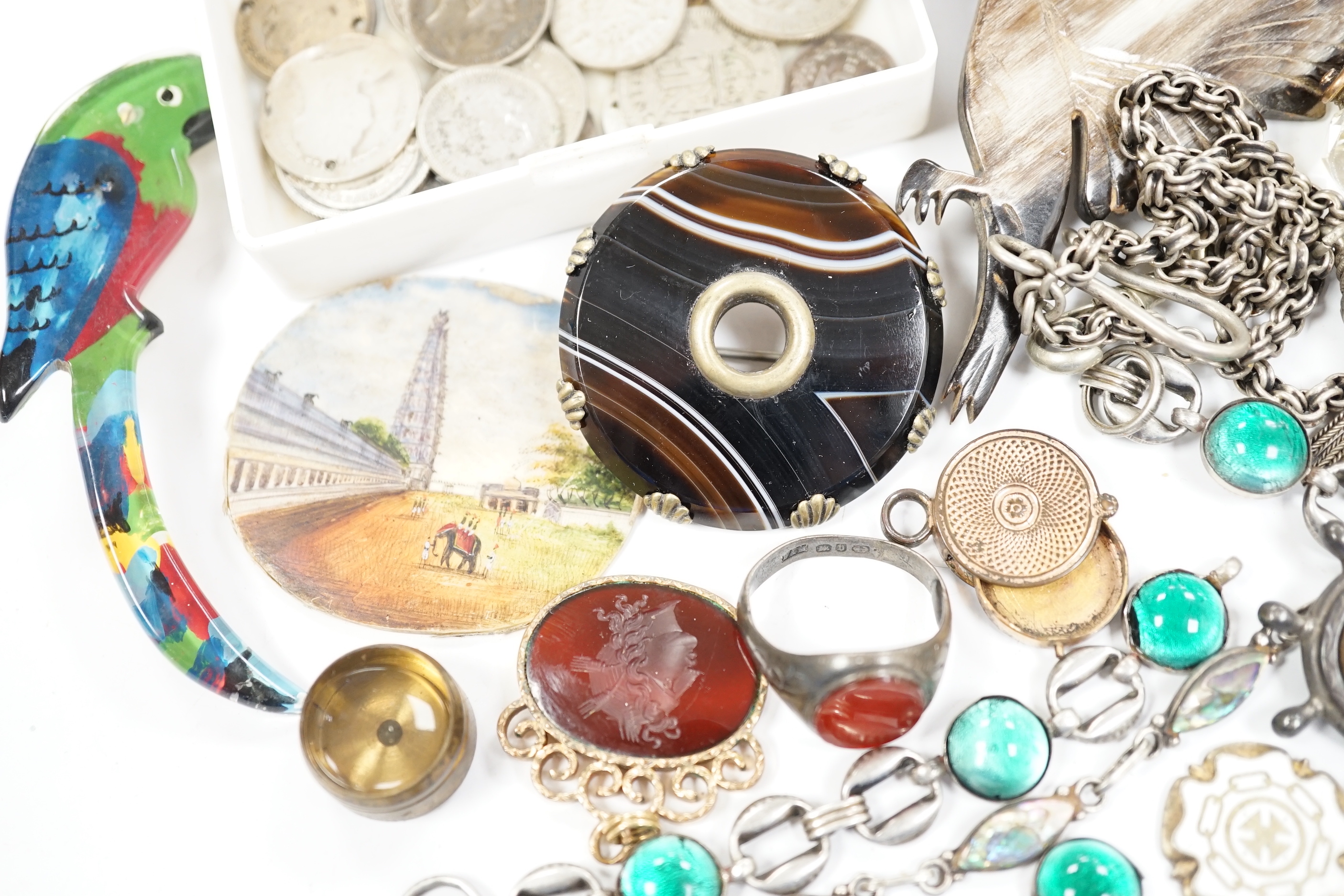 A small quantity of assorted jewellery including a late Victorian silver name brooch 'Polly', 42mm, a late Victorian 9ct gold and gem set horseshoe ring (stones missing), a late Victorian silver and carnelian set signet